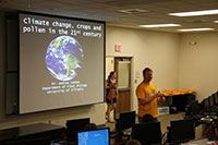 Photo of Andrew Leakey presenting to a class.